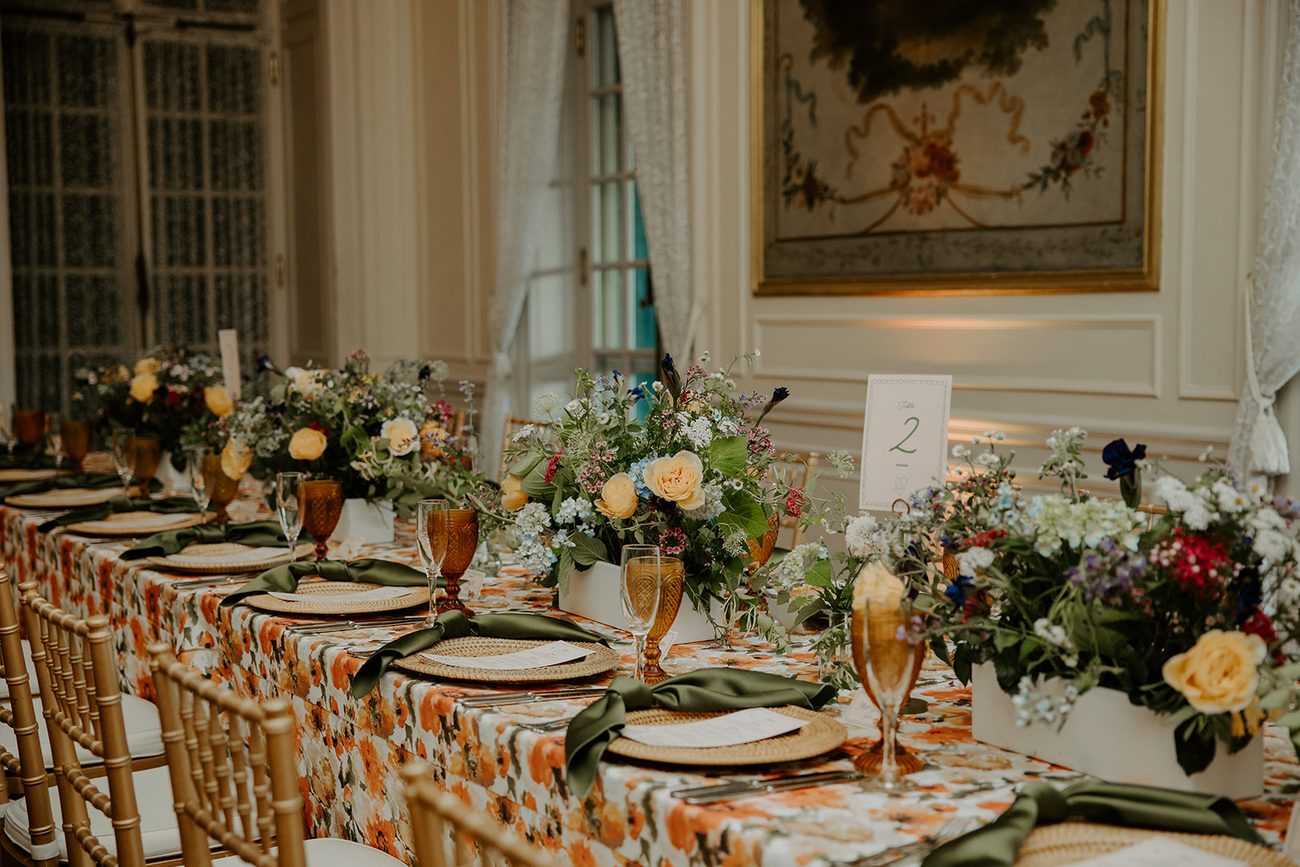 Reception tables set with candles and pastel flowers at Glen Manor House, Portsmouth RI