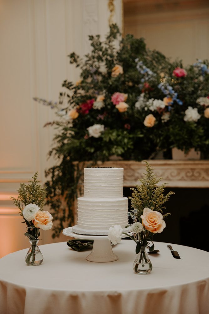 Jim and Anne’s white wedding cake with pastel flowers at Glen Manor House, Portsmouth RI